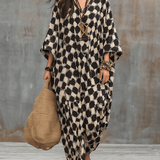 Bohemian-inspired maxi caftan dress with polka dots and loose fit