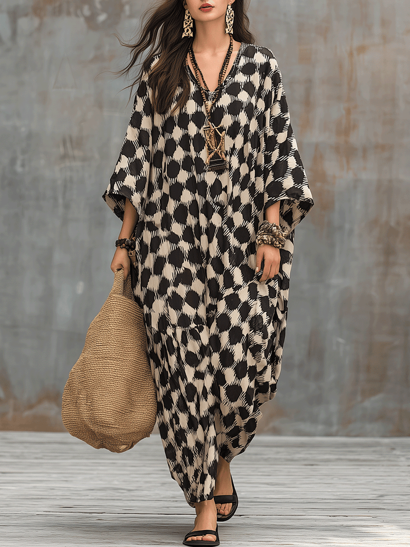 Bohemian-inspired maxi caftan dress with polka dots and loose fit