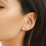Greta – Round earrings with floral design.