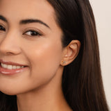 Felicita – Gold earrings with leaf design.
