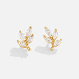 Felicita – Gold earrings with leaf design.