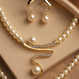 Elegant set of natural pearl earrings and necklace
