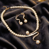 Elegant set of natural pearl earrings and necklace
