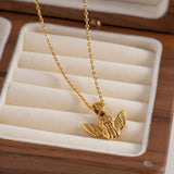 Frieda – Gold necklace with angel wing pendant