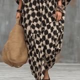 Bohemian-inspired maxi caftan dress with polka dots and loose fit