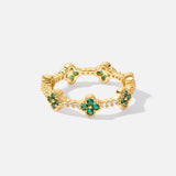 Annika Ring in gold plating with delicate floral details and a touch of emerald.