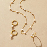 Elisa-Marie – Gold Earrings with Hanging Pearls.