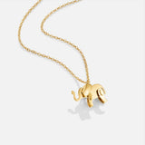 Luisa – Gold necklace with symmetrical floral design.