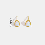 Melina – Small golden hoops with an elegant perforated design.
