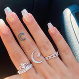 Silver ring with moon and stars design