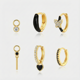 Theresia – Gold earrings with elegant curve.