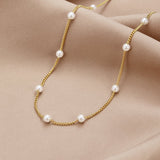 Klara – Double gold necklace with pearl details