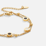 Carla – Elegant gold bracelet with contrasting round details.