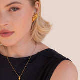 Leonora – Gold Earrings with Wavy Design