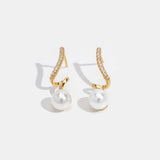 Silver earrings with transparent drop design.