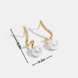 Silver earrings with transparent drop design.