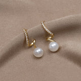 Silver earrings with transparent drop design.