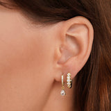 Magdalena – Silver earrings with an open hoop design.