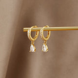 Magdalena – Silver earrings with an open hoop design.