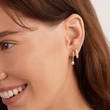 Magdalena – Silver earrings with an open hoop design.