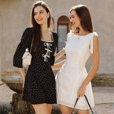 Embroidered short dress with bows